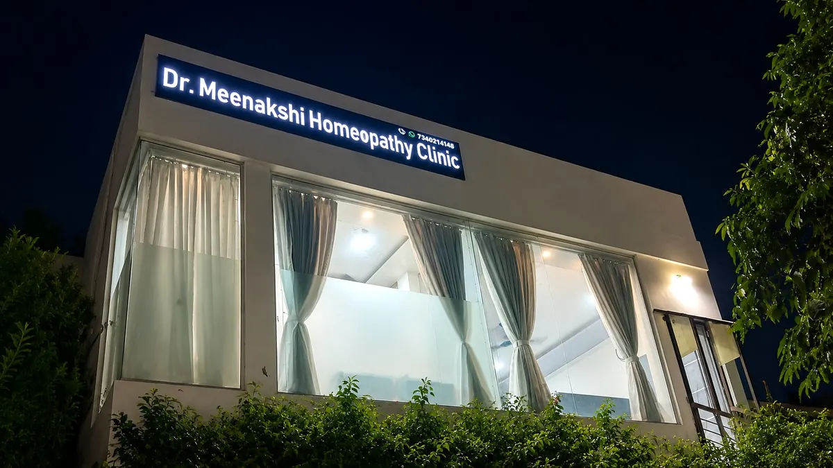 Dr. Meenakshi Homeopathy Clinic illuminated at night — Udaipur